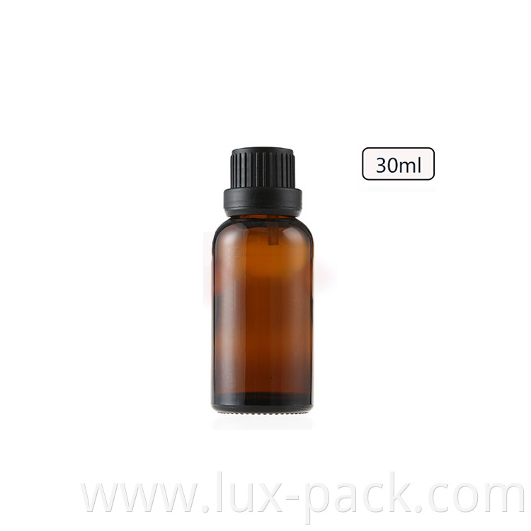 Wholesale New Empty Amber Cosmetic Essential Oil Glass Bottle With Tamper Evident Cap